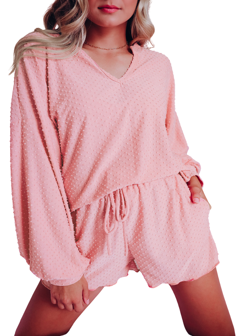 "Chic pink polka-dot loungewear set, featuring a comfy V-neck top and matching shorts with a drawstring waist for a relaxed fit