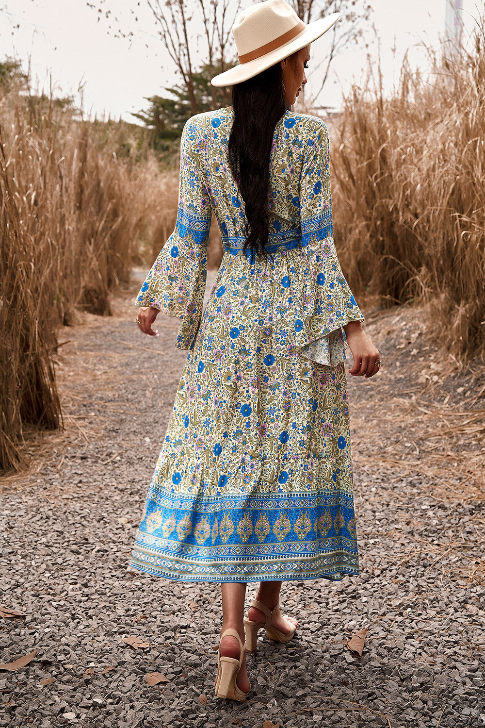 Bohemian-style Maxi Dress with floral patterns and flowy sleeves.