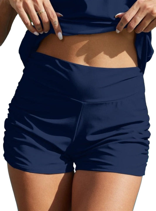 Elegant Ruched Swim Shorts in black/navy. Flattering mid-rise fit, quick-dry fabric, perfect for beach days or pool lounging.