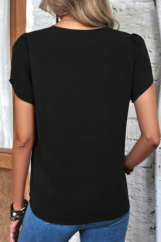 Chic black top featuring a scalloped edge neckline