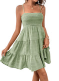 Chic sleeveless smocked green dress with tiered skirt, perfect for summer. Available in 8 colors. Get yours today!