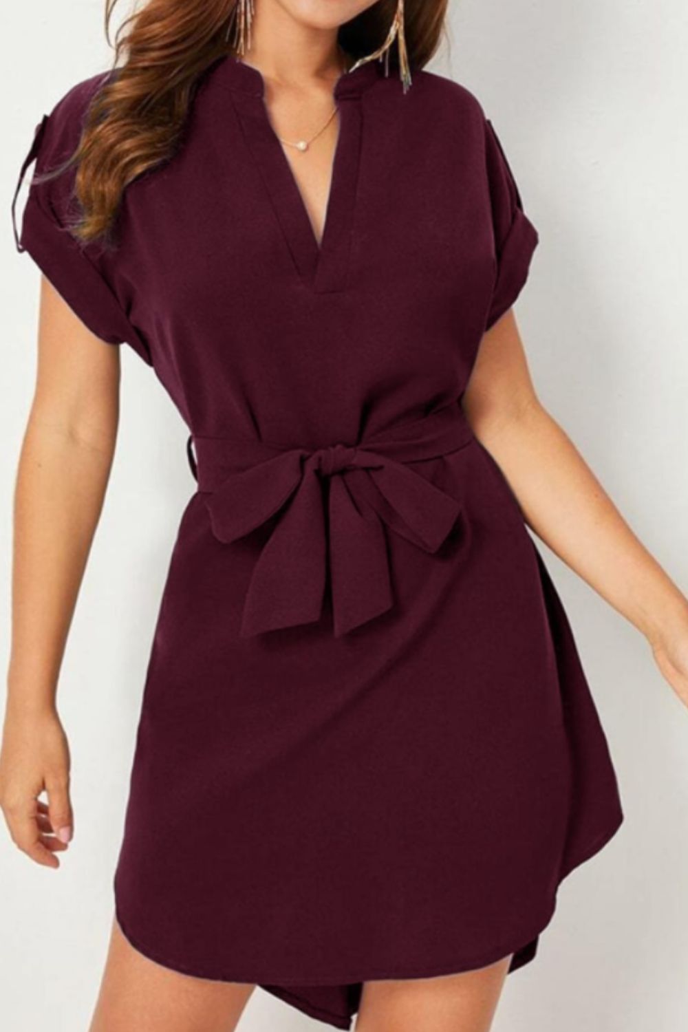 Discover the chic Tied Notched Dress! Flattering tie-waist, versatile style, available in 6 colors. Perfect for any occasion. Shop now!