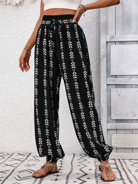 Black boho chic drawstring pants with intricate pattern