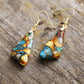 Elegant teardrop earrings made from multicolored stones and gold hardware