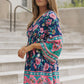 Bohemian flowy floral dress in deep blue with vibrant patterns
