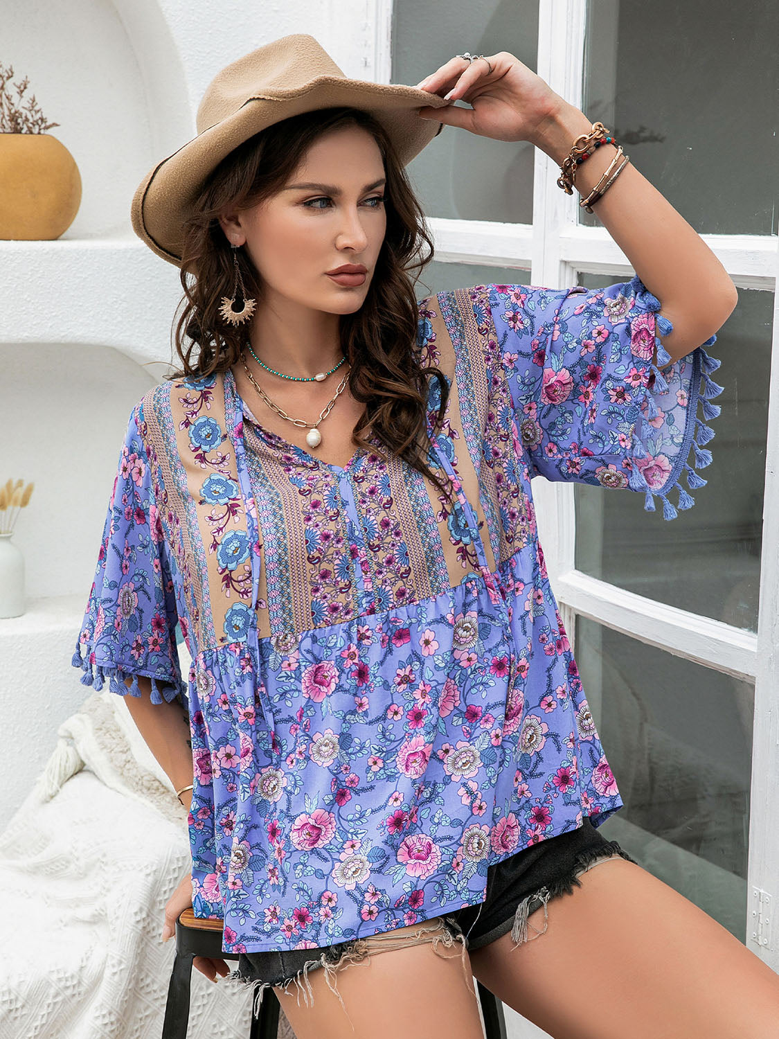 Stylish purple floral blouse with lace accents and short sleeves