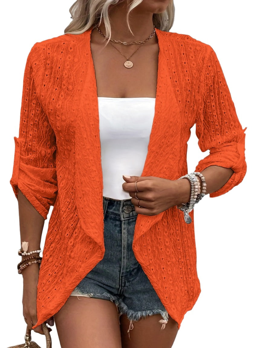 Versatile orange cardigan with roll-up sleeves.