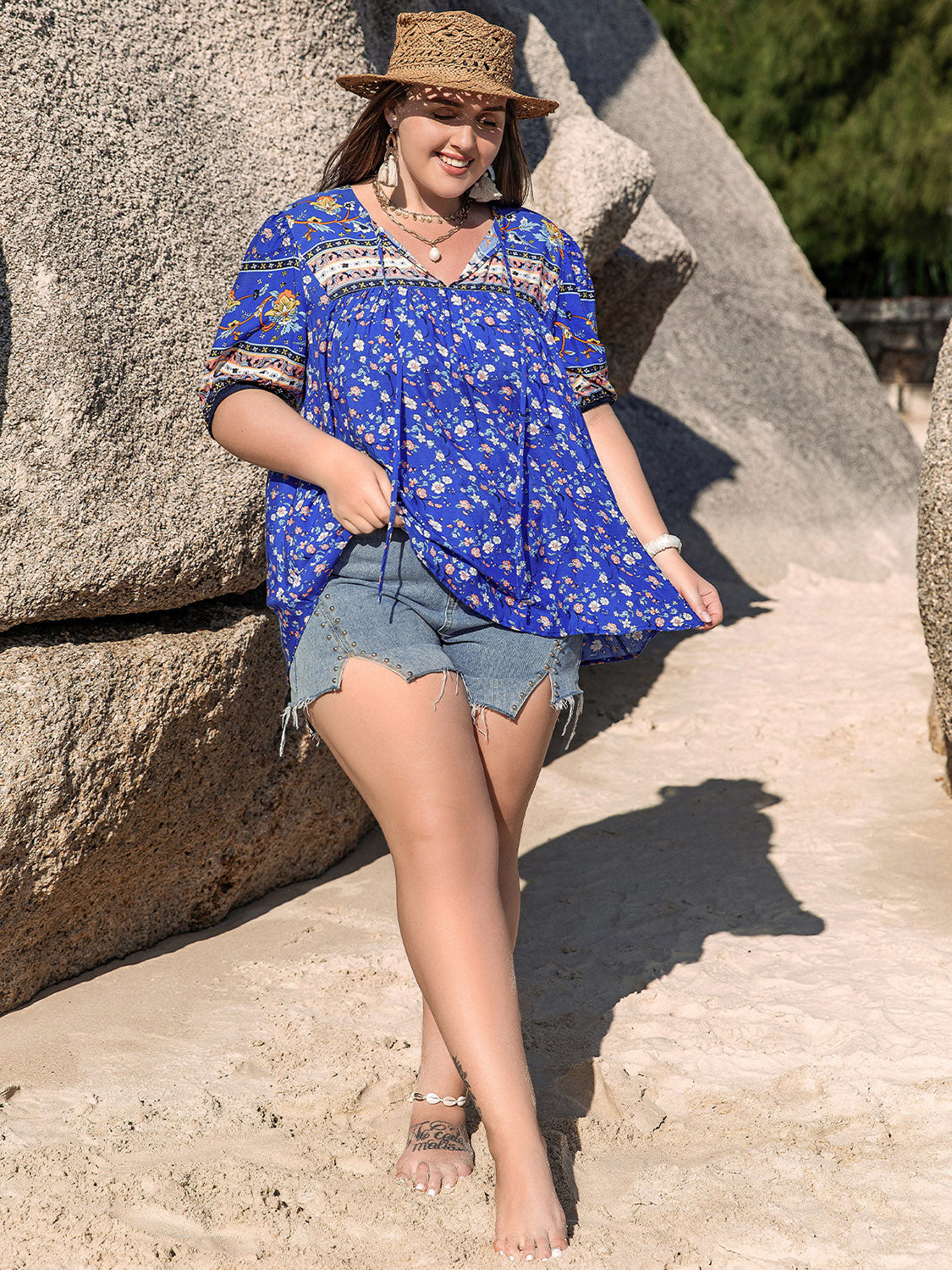 Lightweight blue blouse with whimsical floral design