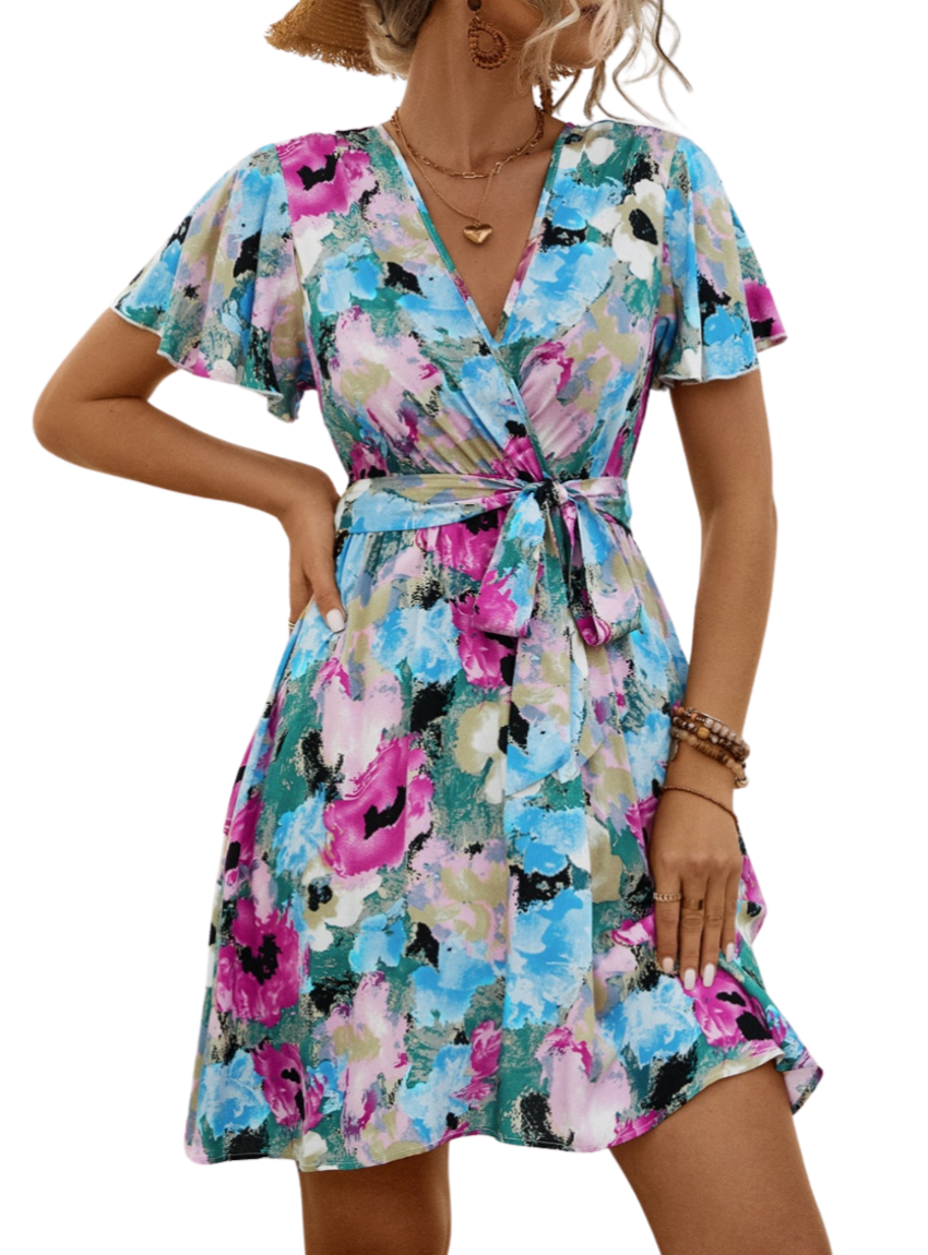 Shop the Printed Surplice Tie Waist Mini Dress – perfect blend of elegance, comfort, and vibrant style for any spring occasion.
