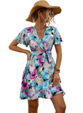 Shop the Printed Surplice Tie Waist Mini Dress – perfect blend of elegance, comfort, and vibrant style for any spring occasion.