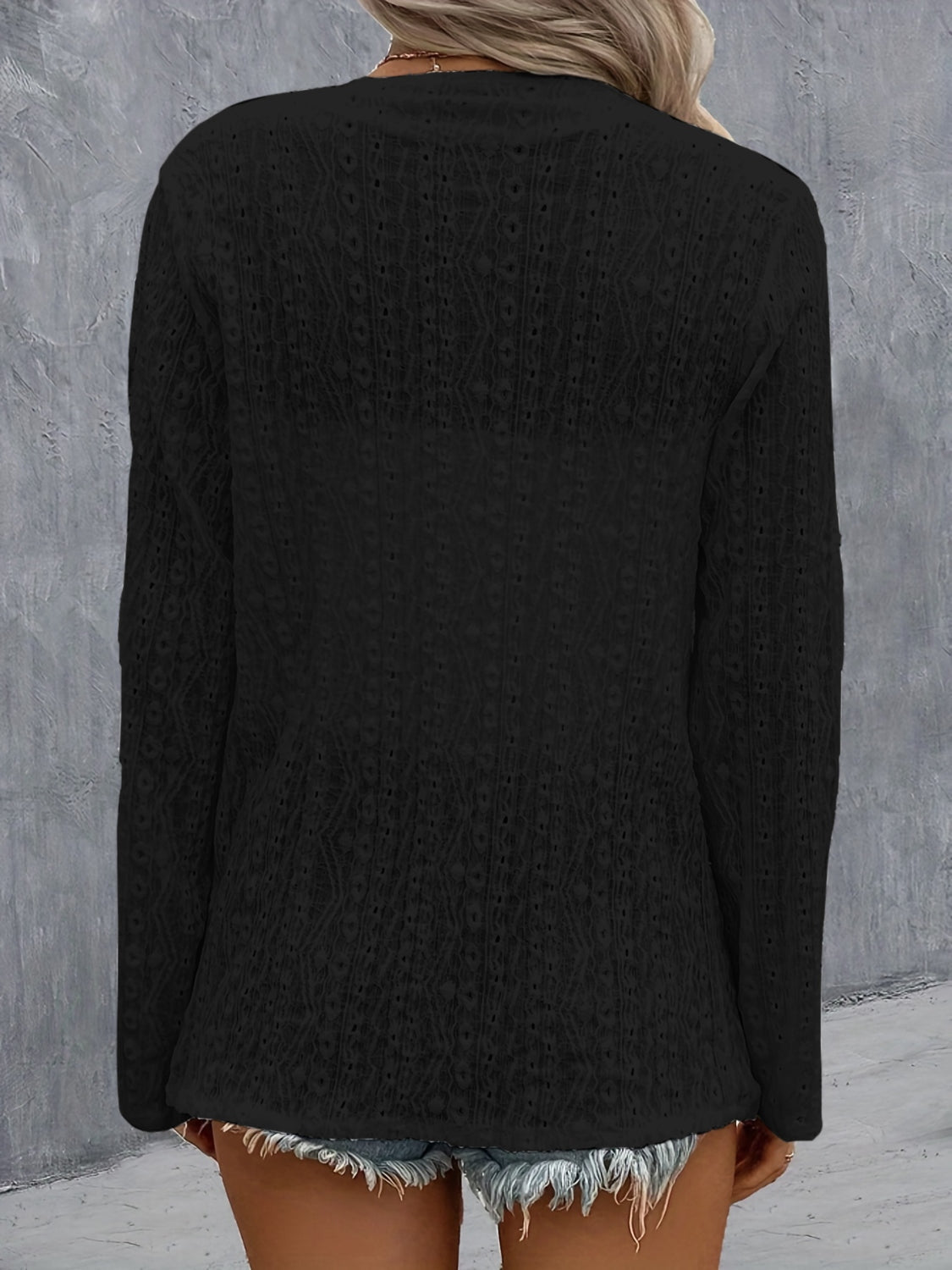 Lightweight black cardigan with open front design.