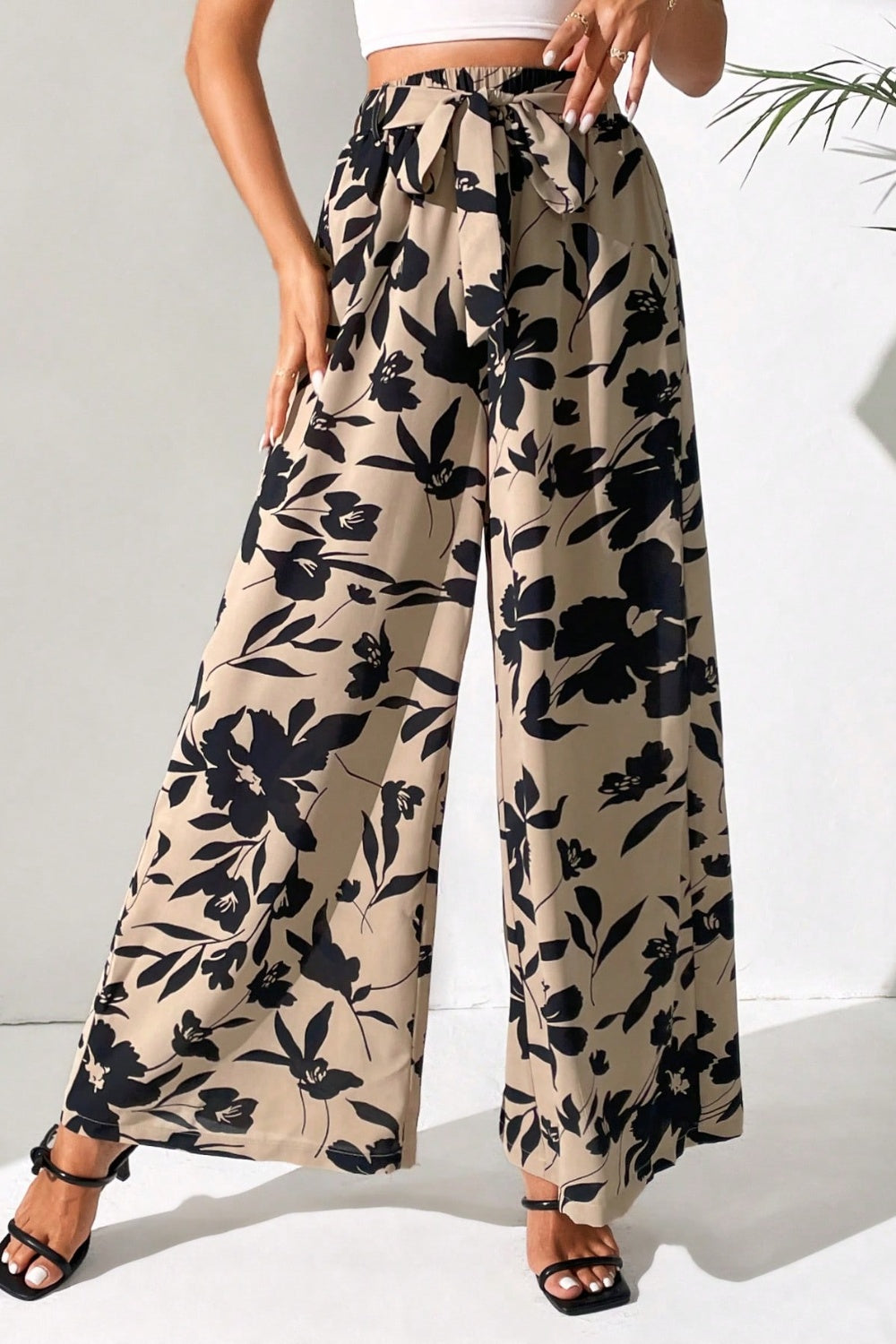 Upgrade your style effortlessly with our Printed Tied Wide Leg Pants. Chic, comfortable, and versatile - perfect for any occasion. Shop now!