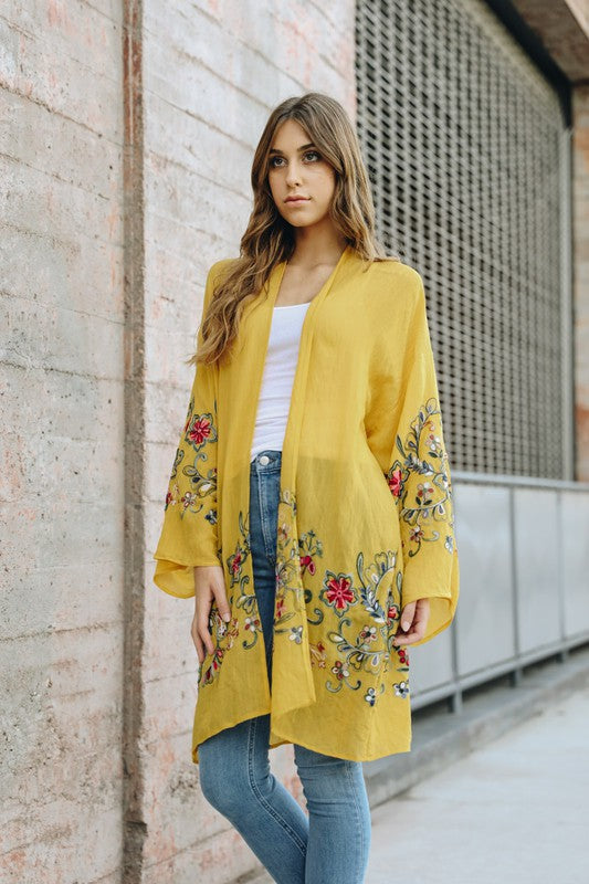 Mustard yellow kimono for women featuring intricate floral embroidery