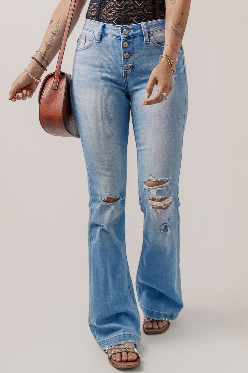 Shop the latest Button-Fly Distressed Flare Jeans - a perfect fusion of vintage style and edgy modern fashion for a chic, versatile look