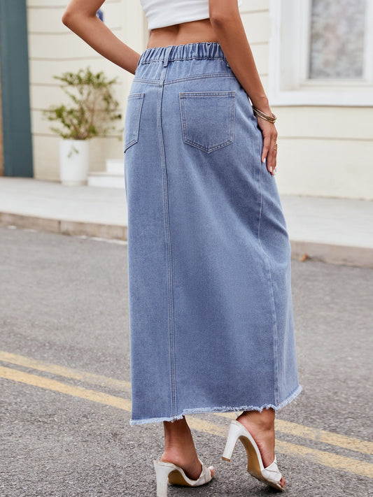 Casual denim skirt with a raw hem and front slit.