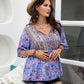 Chic purple boho blouse with floral patterns and tie-front detailing