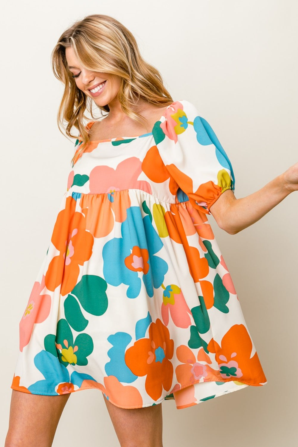 Shop the BiBi Floral Puff Sleeve Mini Dress - your go-to for a vibrant, easy-to-wear spring look that flatters and charms