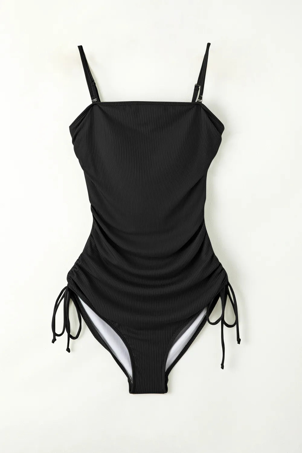 Elevate your beach style with our chic, adjustable one-piece swimsuit. Perfect fit, enduring comfort, and timeless elegance.