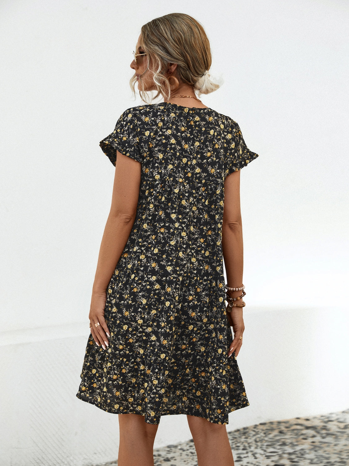 Summer's charm in a dress! Discover our Floral Tiered Dress, perfect for day/night elegance. Available in black and sand.