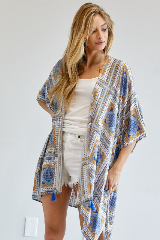 Flowy kimono with colorful geometric patterns, available in yellow and blue