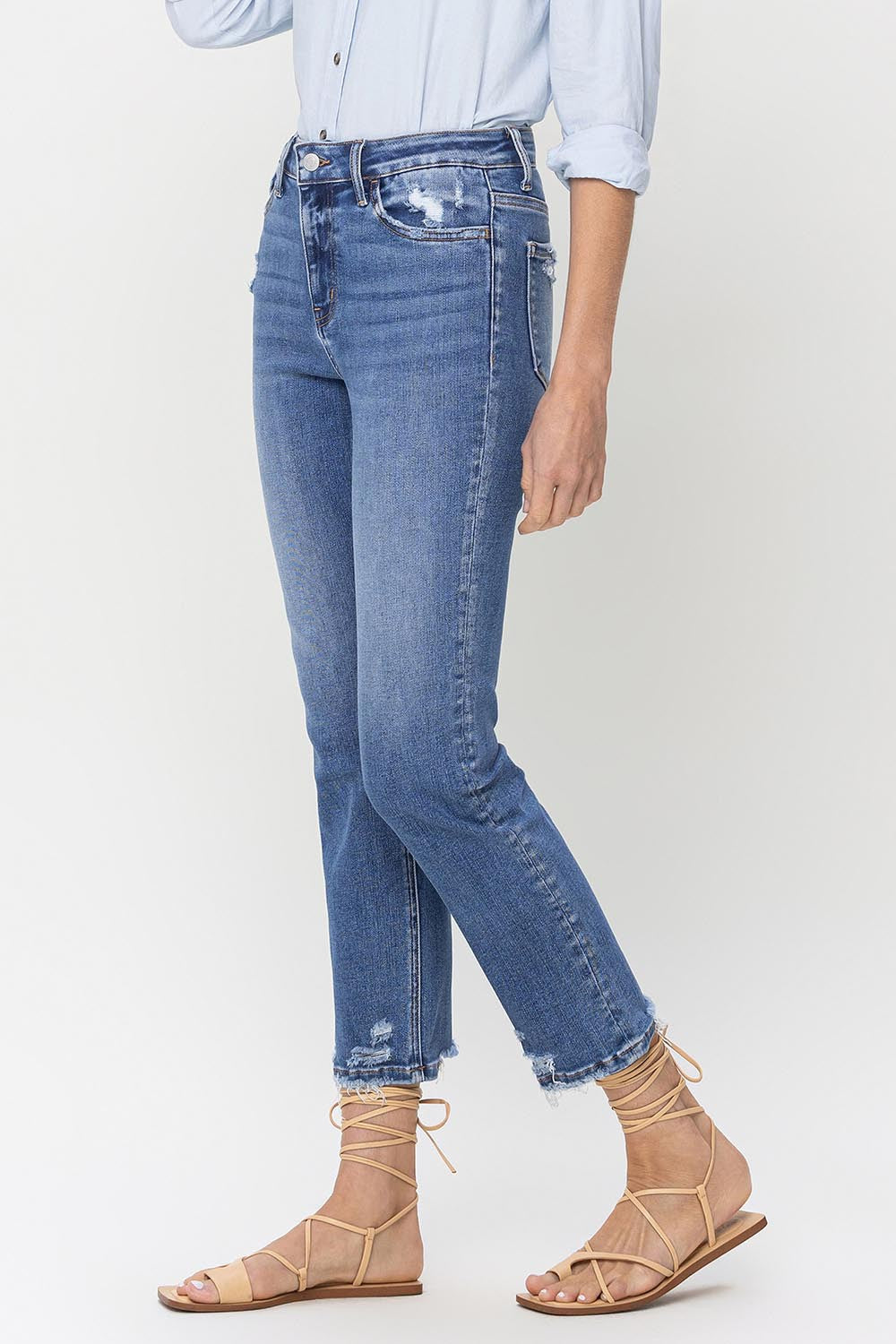 Discover Lovervet High Rise Jeans: perfect stretch for comfort, raw hem for edge. Elevate your style with a timeless classic!