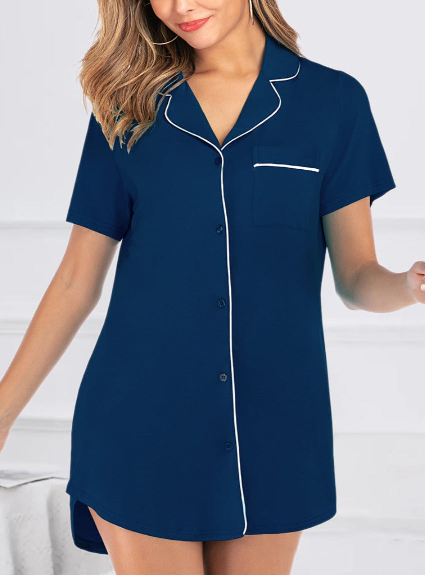 Chic short sleeve lounge dress with contrast piping and pockets, in sky blue, black, and navy. Perfect blend of comfort and style for any occasion