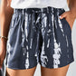 Stay comfy & stylish in our blue tie-dye drawstring shorts with pockets - perfect for summer days out or cozy weekends.