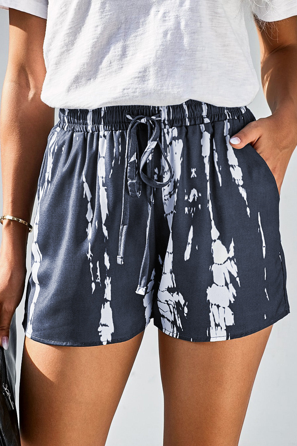 Stay comfy & stylish in our blue tie-dye drawstring shorts with pockets - perfect for summer days out or cozy weekends.