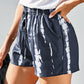 Stay comfy & stylish in our blue tie-dye drawstring shorts with pockets - perfect for summer days out or cozy weekends.