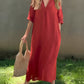 Comfortable and elegant red maxi dress with a V-neckline.