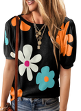 Vibrant short sleeve blouse with colorful floral print, perfect for adding a cheerful touch to any casual or semi-casual outfit.