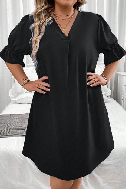 Elevate your style with our Plus Size Mini Dress featuring a chic V-neck and ruffled puff sleeves for a flattering, fashionable look.