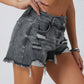 Chic distressed denim shorts with a raw hem, perfect for summer. Versatile, comfortable, and effortlessly stylish for any casual occasion.