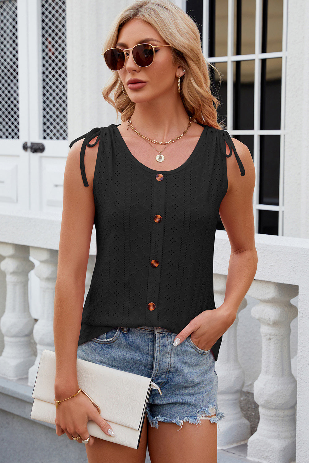 Discover elegance with our Eyelet Tank! A round neck, wide straps, and breathable fabric offer style and comfort for any occasion. Shop now!