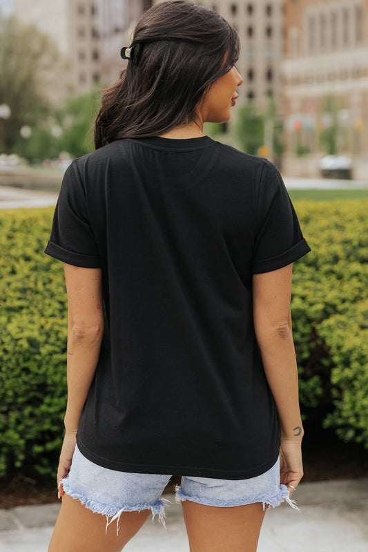 Black short-sleeve top with a prominent pink and white bow design.