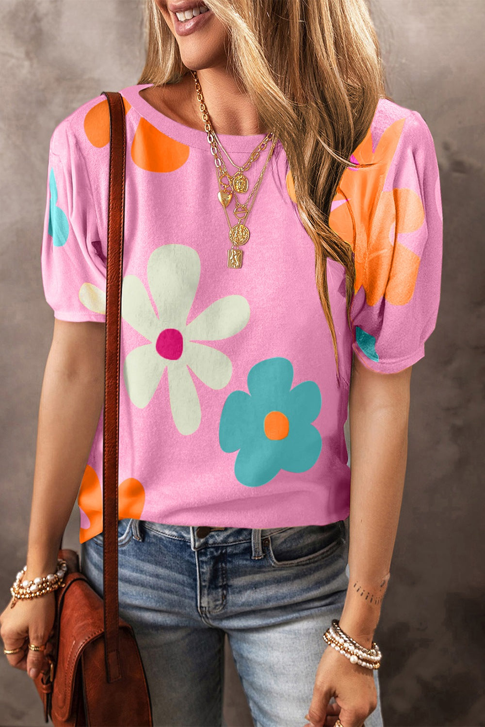 Vibrant short sleeve blouse with colorful floral print, perfect for adding a cheerful touch to any casual or semi-casual outfit.