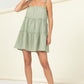 Light green tiered dress with adjustable spaghetti straps