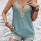 Blue lace-trimmed spaghetti strap tank with intricate neckline detailing