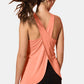 Coral Crisscross Scoop Neck Active Tank Top featuring a chic cross-back design.