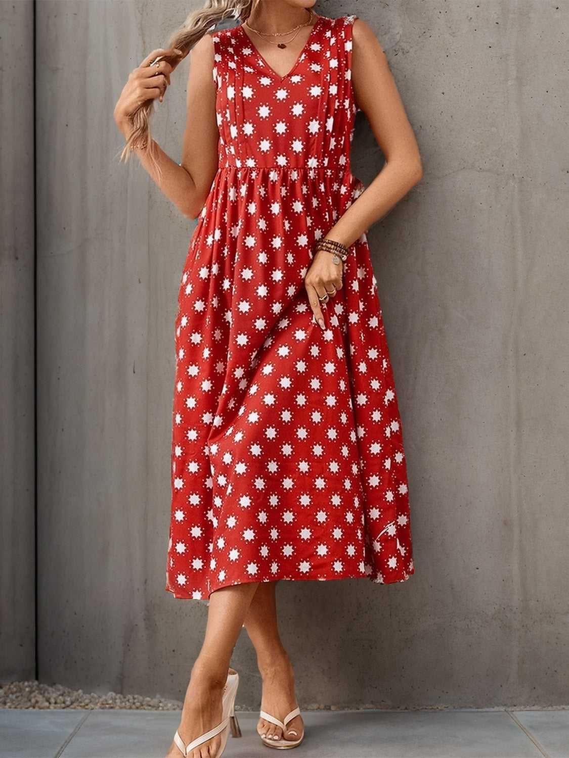 Red midi dress with a floral pattern and breathable fabric.
