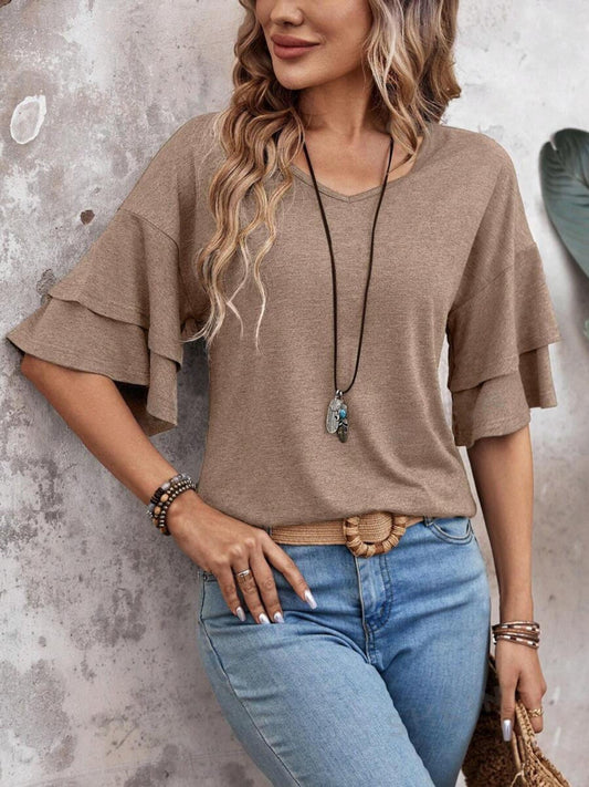 Casual brown top with charming flutter sleeves.