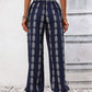 Navy drawstring pants featuring a stylish bohemian print