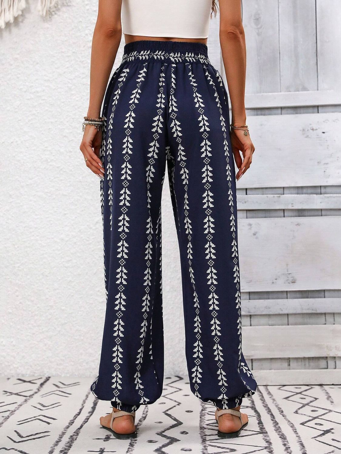 Navy drawstring pants featuring a stylish bohemian print