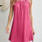 Chic Eyelet Grecian Neck Mini Dress available in 7 hues. Perfect blend of elegance & style for any occasion.