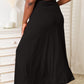 Simple and chic black rayon skirt with a drawstring waist.