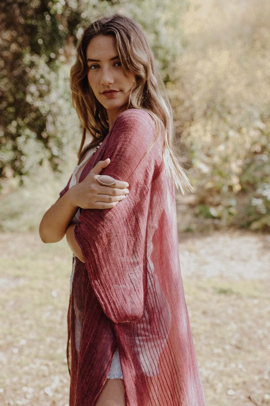 Vibrant red sheer kimono with flowy fit.