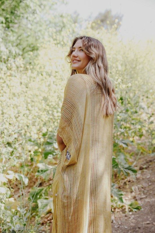 Vibrant yellow sheer kimono with flowy fit.