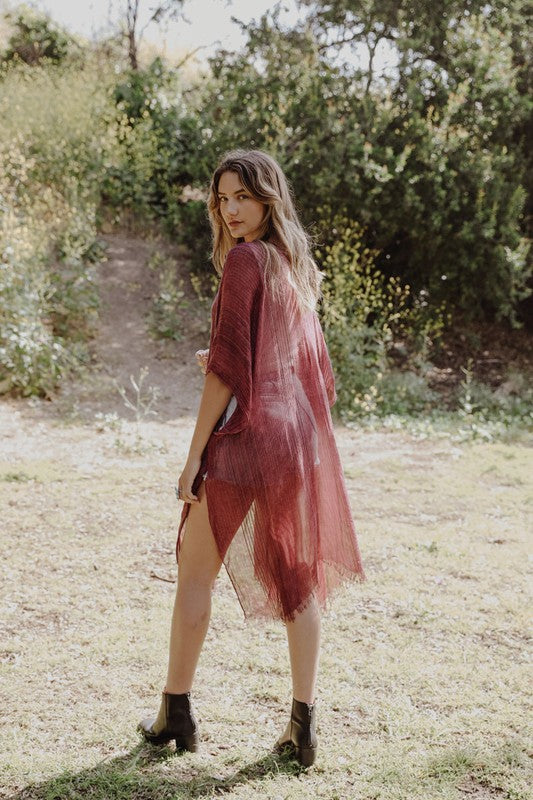 Sheer red kimono with breathable material.