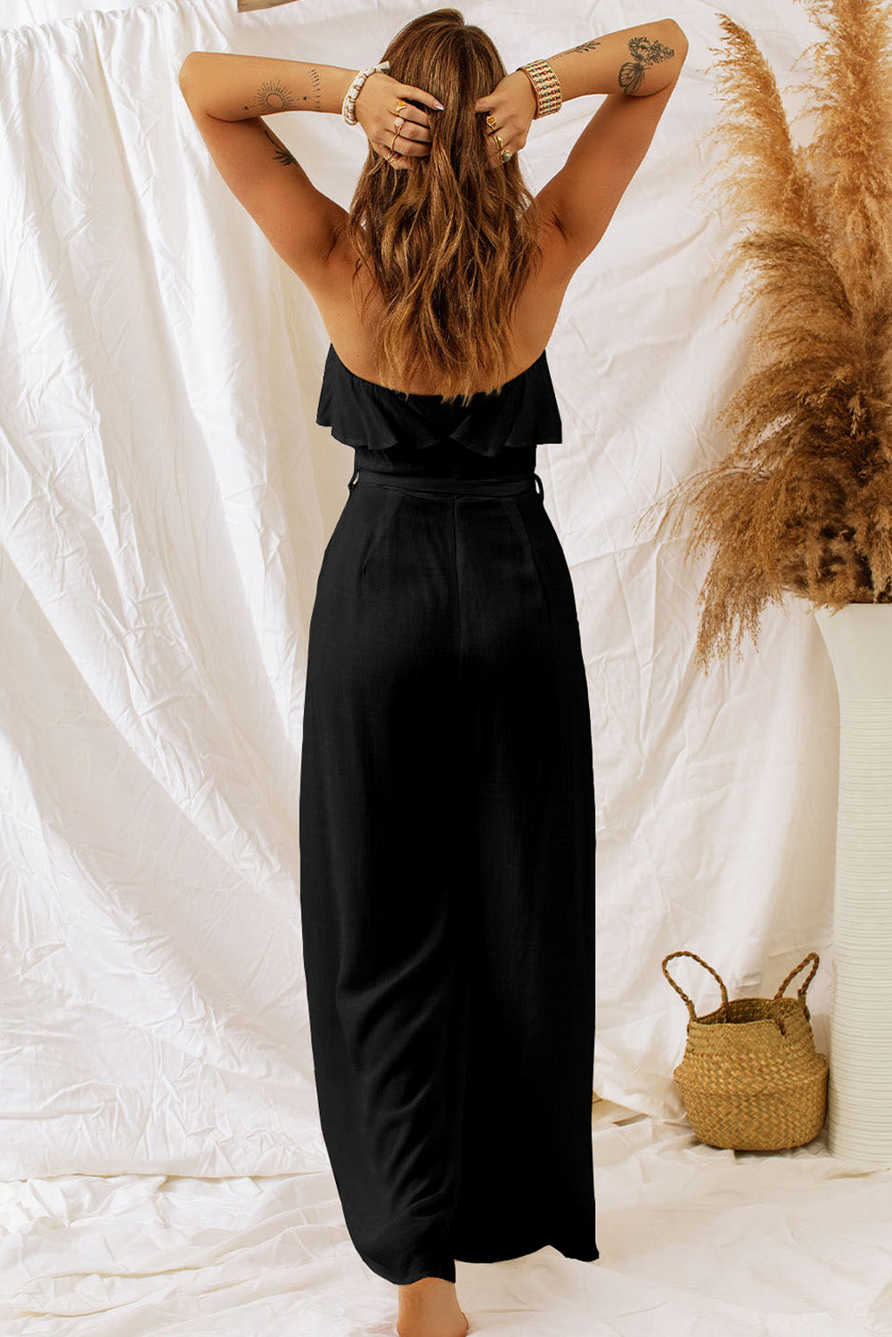 Elevate your style with our Tie-Waist Ruffled Strapless Jumpsuit. Flattering fit, chic design, perfect for any occasion. Available in white and black