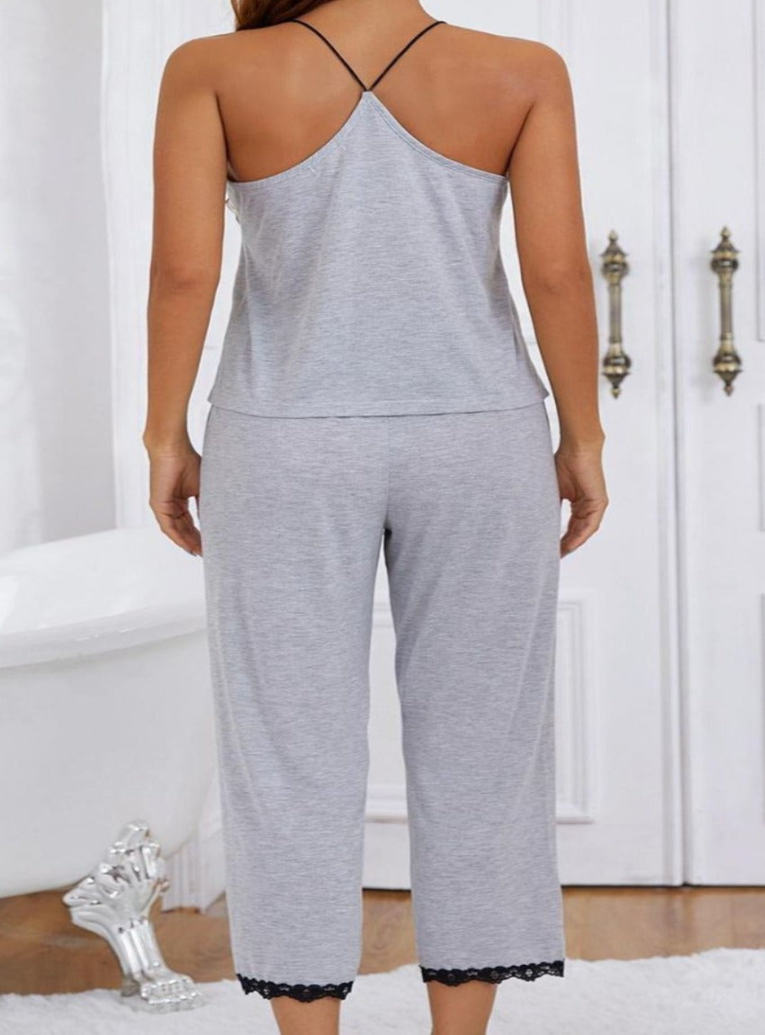 Cozy up in elegance with our soft, lace-trimmed Halter Neck Cami Pajama Set, perfect for stylish lounging and peaceful slumbers